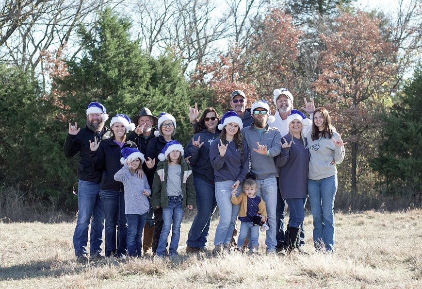 Group-christmas-picture-with-love-sign 2-min